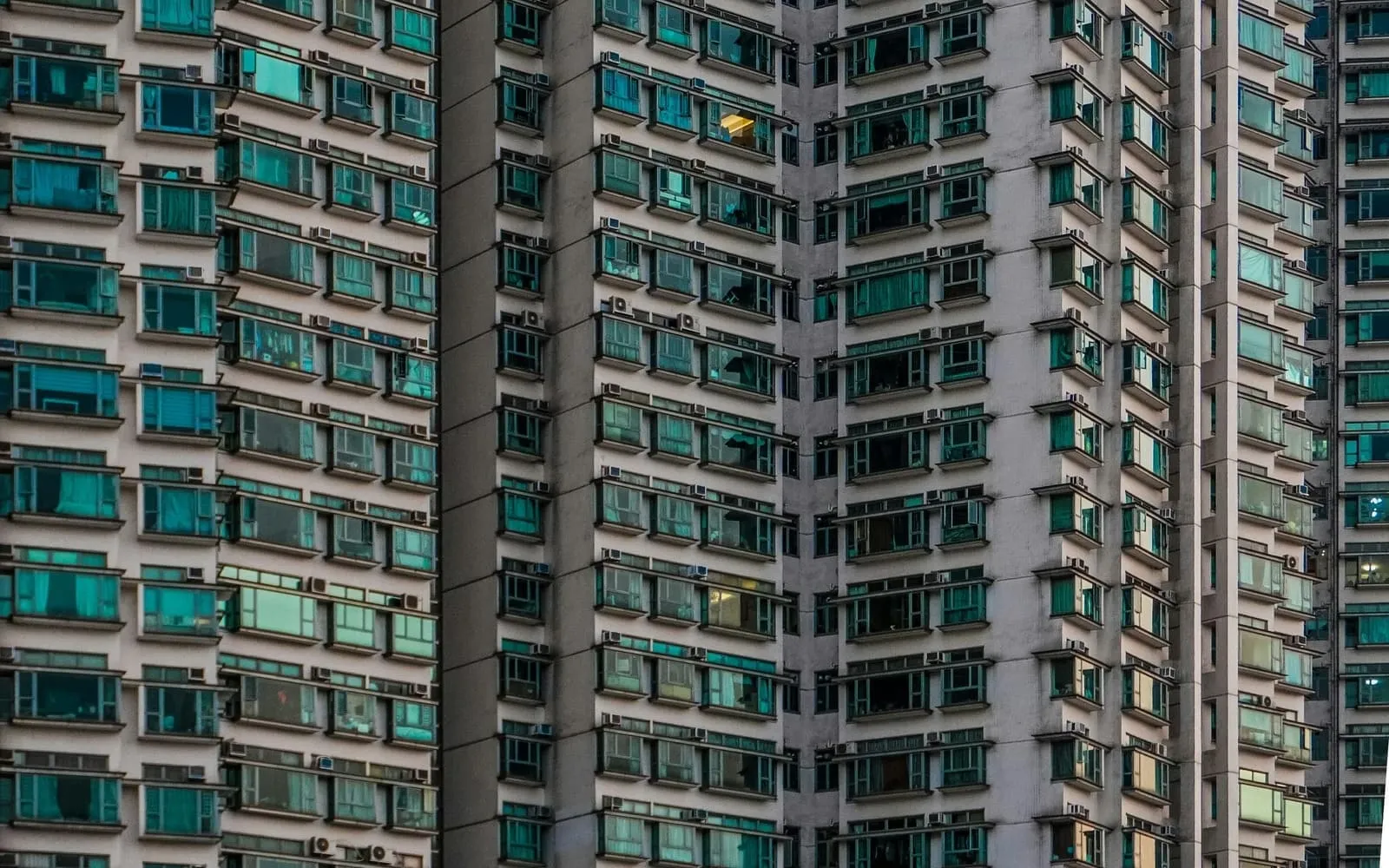 Modern apartment buildings with balconies under a clear sky